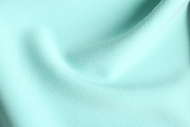 Texture of beautiful light blue fabric as background, closeup