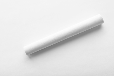 Piece of chalk isolated on white, top view