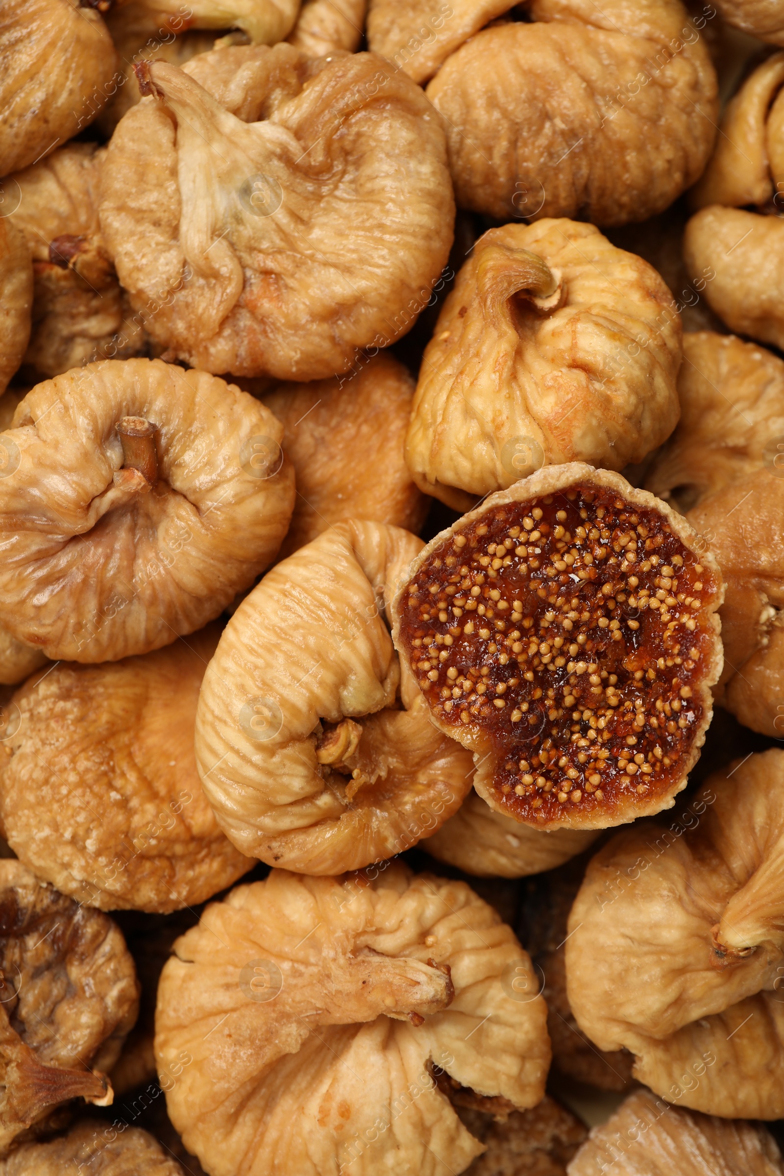 Photo of Many tasty dried figs as background, top view