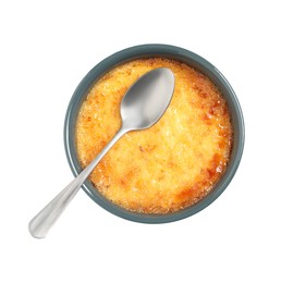Photo of Delicious creme brulee and spoon in ceramic ramekin isolated on white, top view