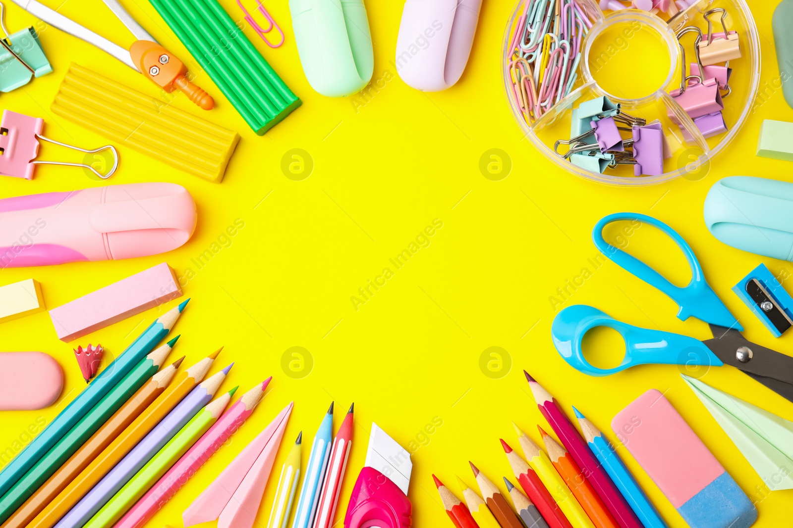 Photo of Flat lay composition with different school stationery on yellow background, space for text. Back to school