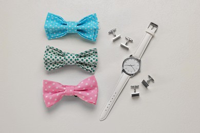 Flat lay composition with stylish color bow ties on white background