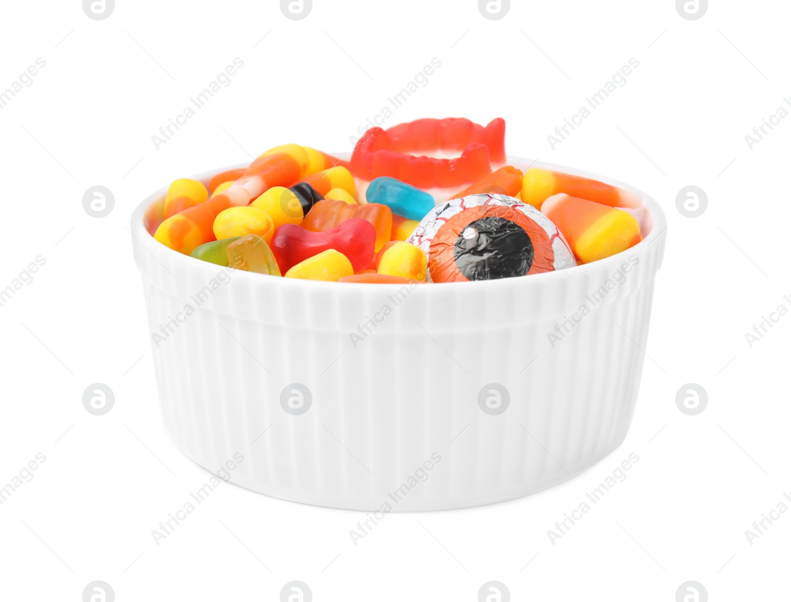 Photo of Bowl of delicious colorful candies isolated on white. Halloween sweets