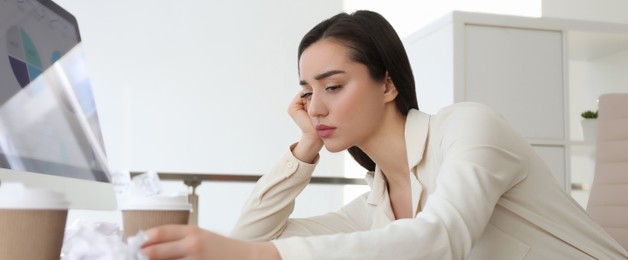 Image of Tired businesswoman stressing out at workplace in office. Banner design