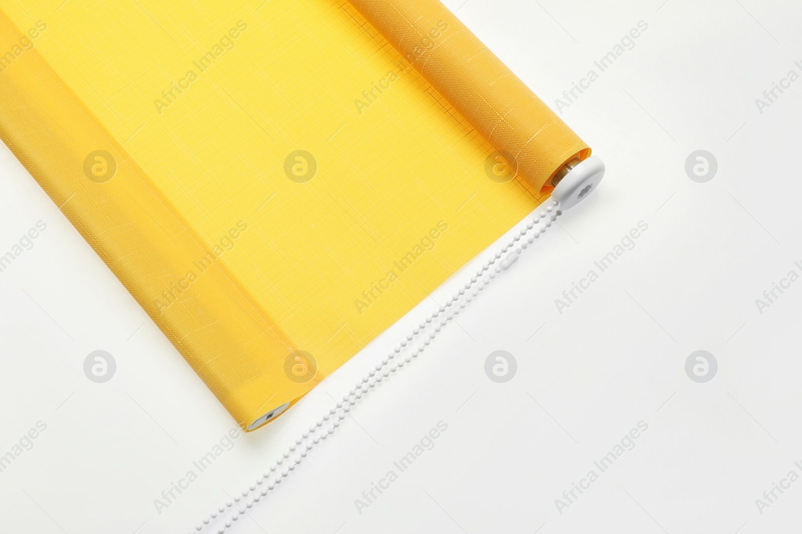 Photo of Stylish roller window blinds on white background, top view