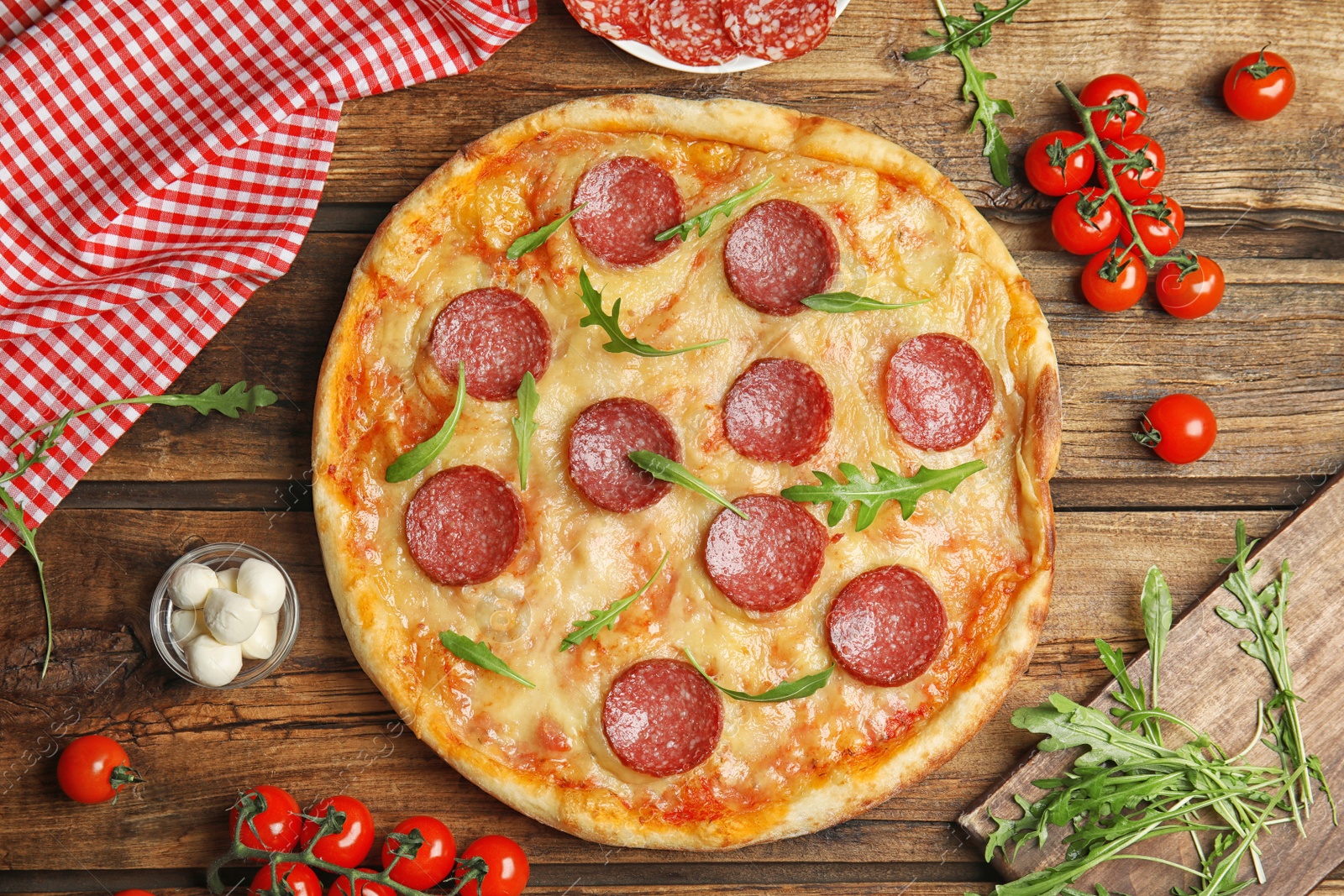 Photo of Flat lay composition with tasty pepperoni pizza on wooden table