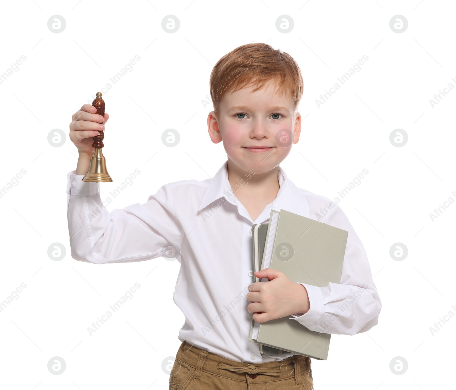 Photo of Pupil with school bell and books on white background