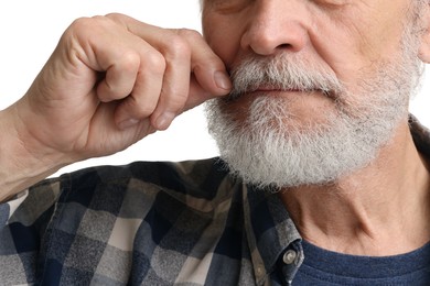 Man touching mustache on white background, closeup