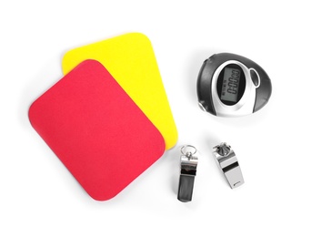 Photo of Whistles, stopwatch, red and yellow cards on white background, top view. Football rules