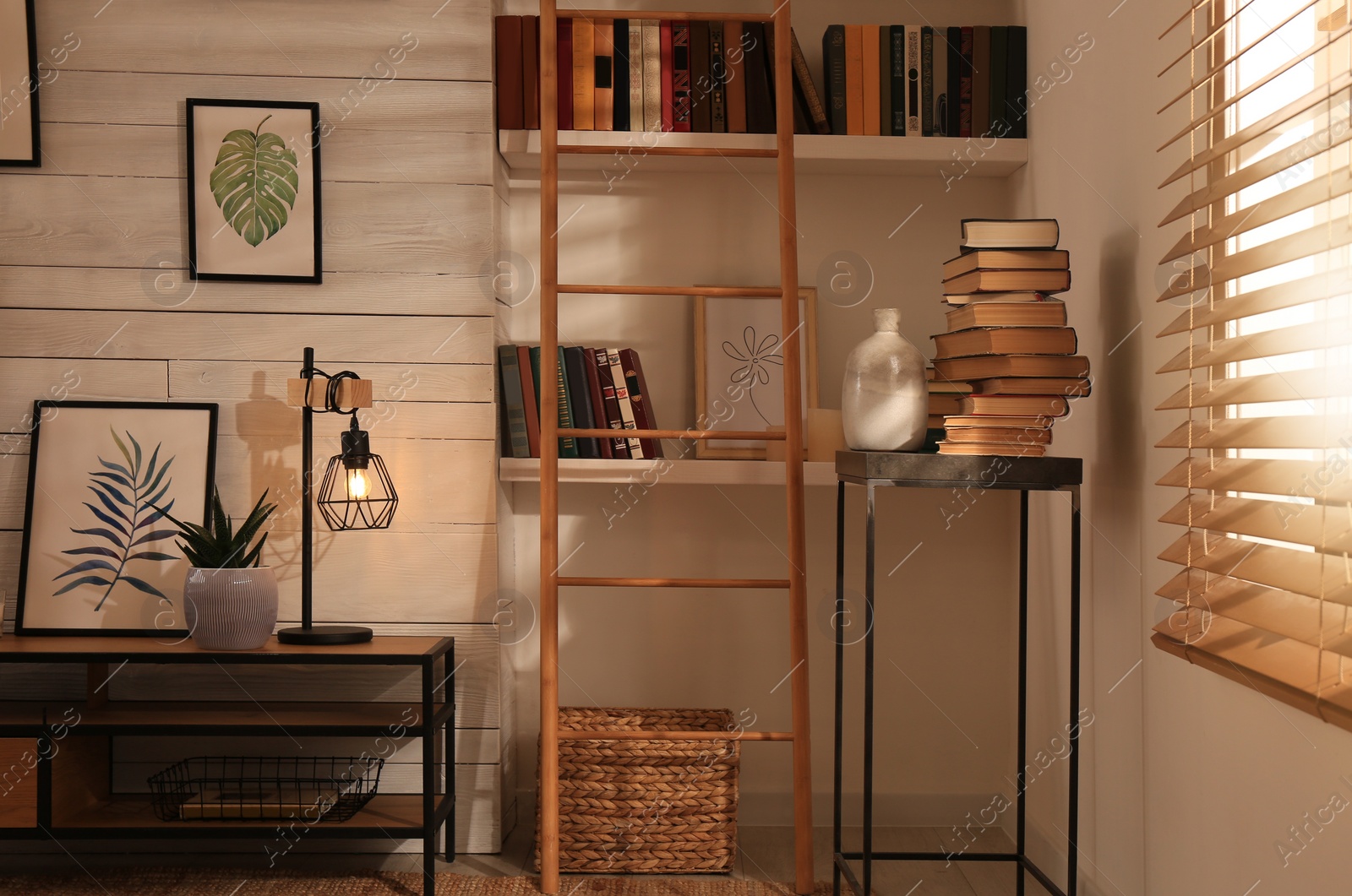 Photo of Home library interior with modern furniture and collection of different books on shelves