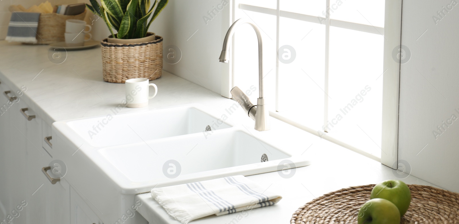 Image of New ceramic sink and modern tap in stylish kitchen interior. Banner design