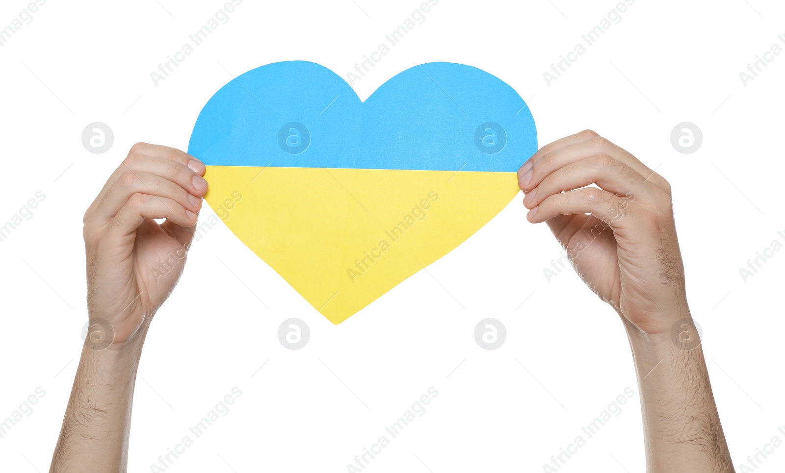 Photo of Man holding paper heart in colors of Ukrainian flag on white background, closeup