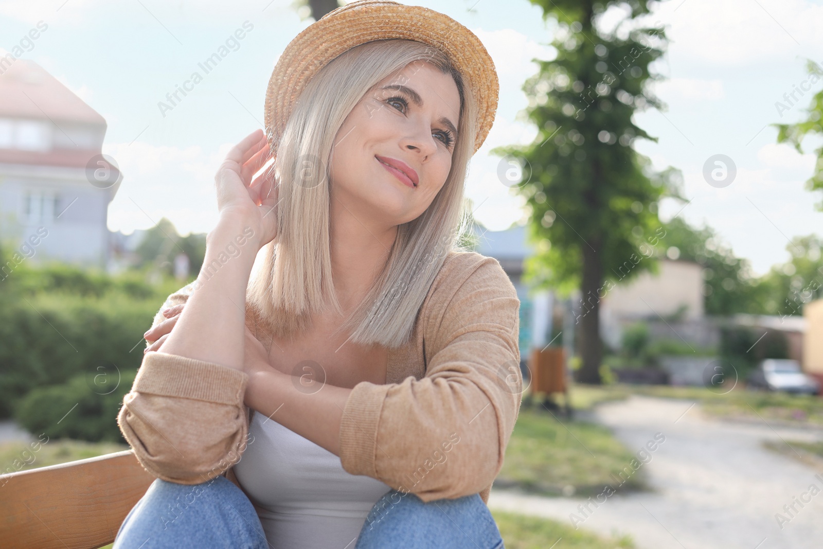 Photo of Portrait of beautiful woman in straw hat outdoors on sunny day