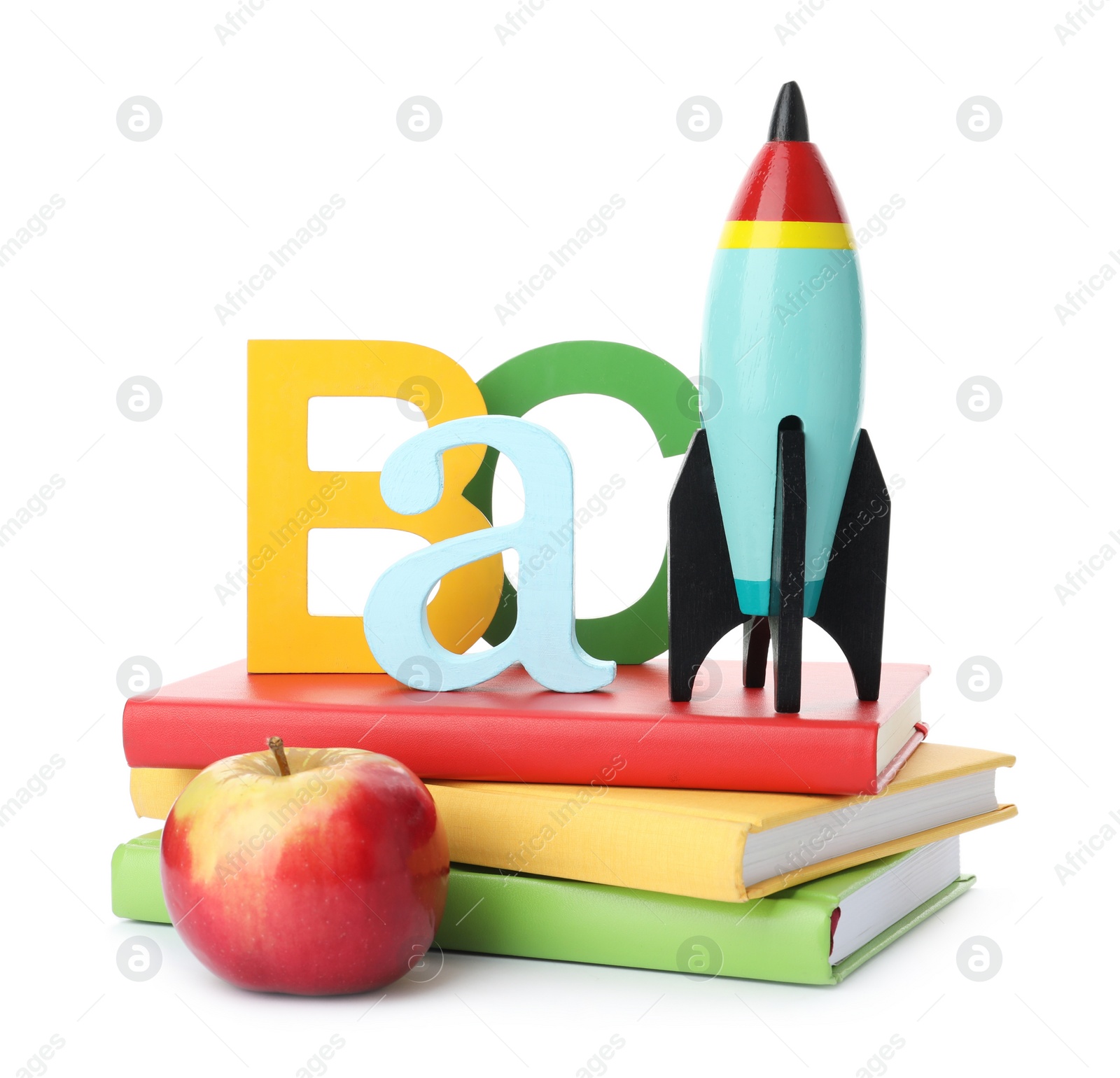 Photo of Bright toy rocket and school supplies on white background