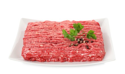 Raw ground meat, parsley and peppercorns isolated on white