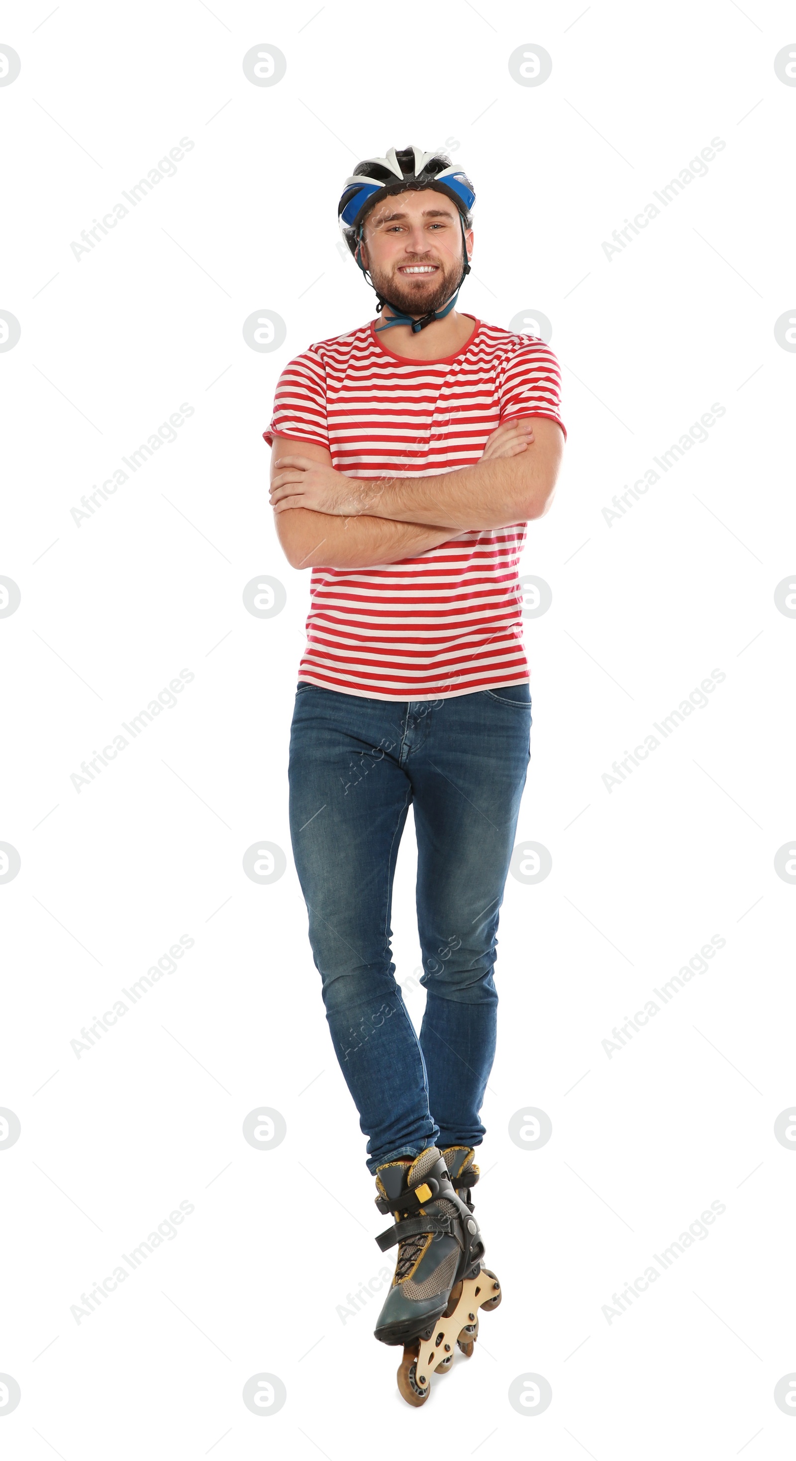 Photo of Full length portrait of young man with inline roller skates on white background