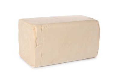 Block of compressed yeast on white background