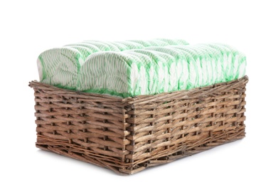 Photo of Basket with diapers on white background. Baby accessories