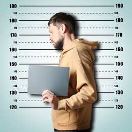 Image of Criminal mugshot. Arrested man with blank card against height chart