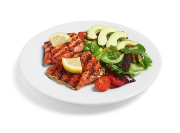 Photo of Tasty grilled salmon with avocado, lemon and tomatoes on white background