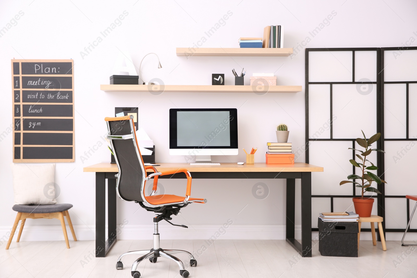 Photo of Modern computer on table in office interior. Stylish workplace