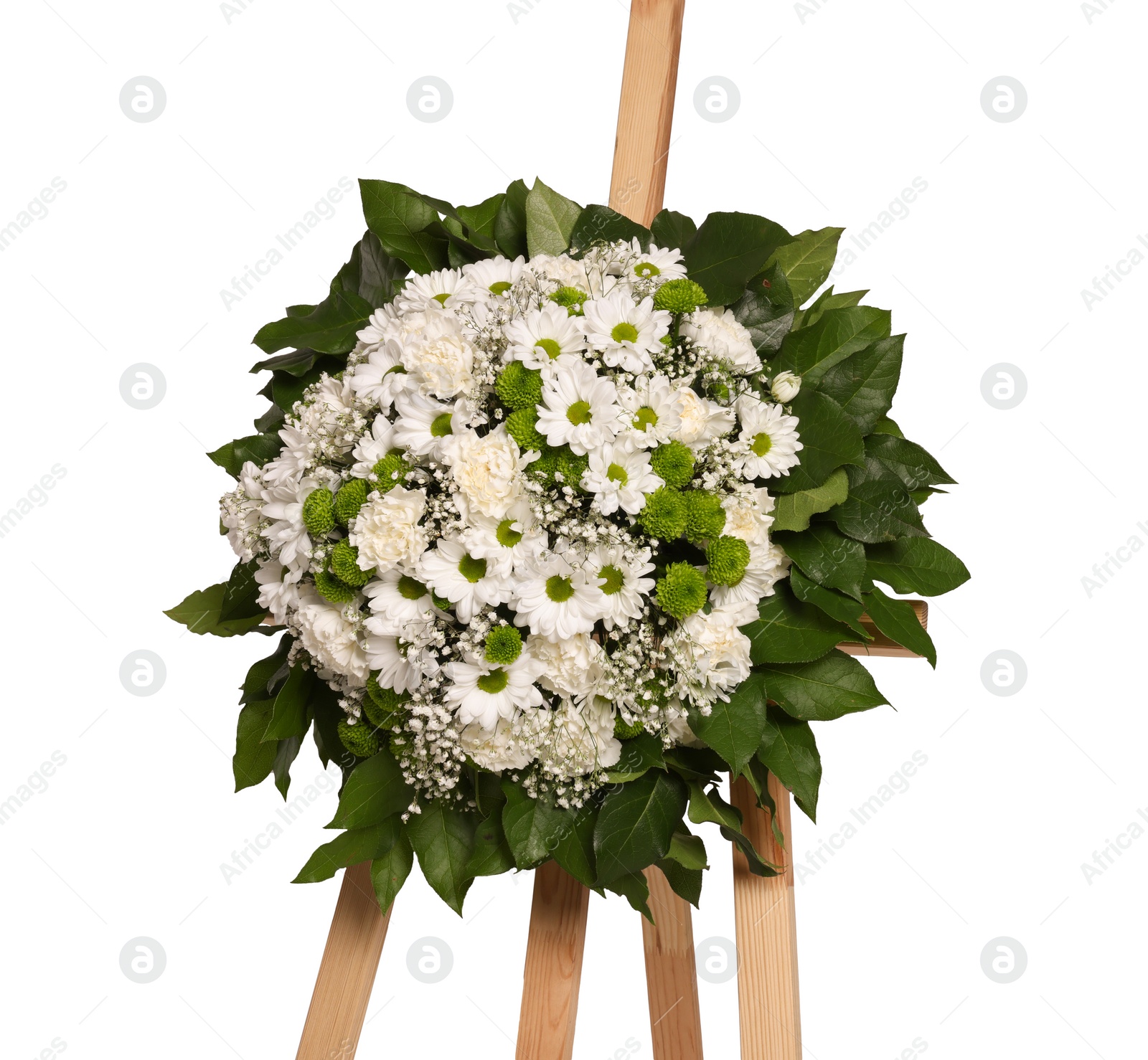 Photo of Funeral wreath of flowers on wooden stand against white background
