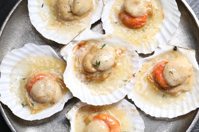 Fried scallops in shells on table, top view