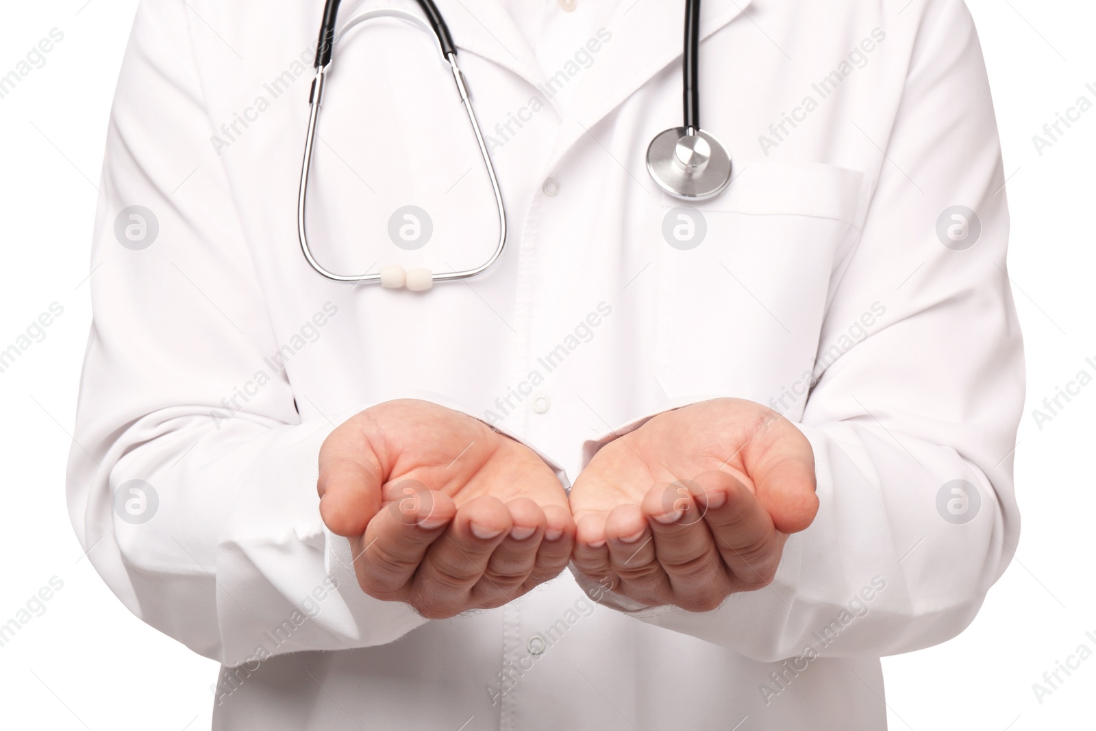 Photo of Doctor with stethoscope holding something on white background, closeup. Cardiology concept