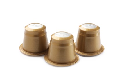 Photo of Three plastic coffee capsules isolated on white