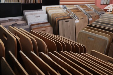 Photo of Many different samples of wooden flooring in store