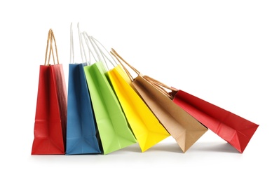 Photo of Colorful paper shopping bags on white background