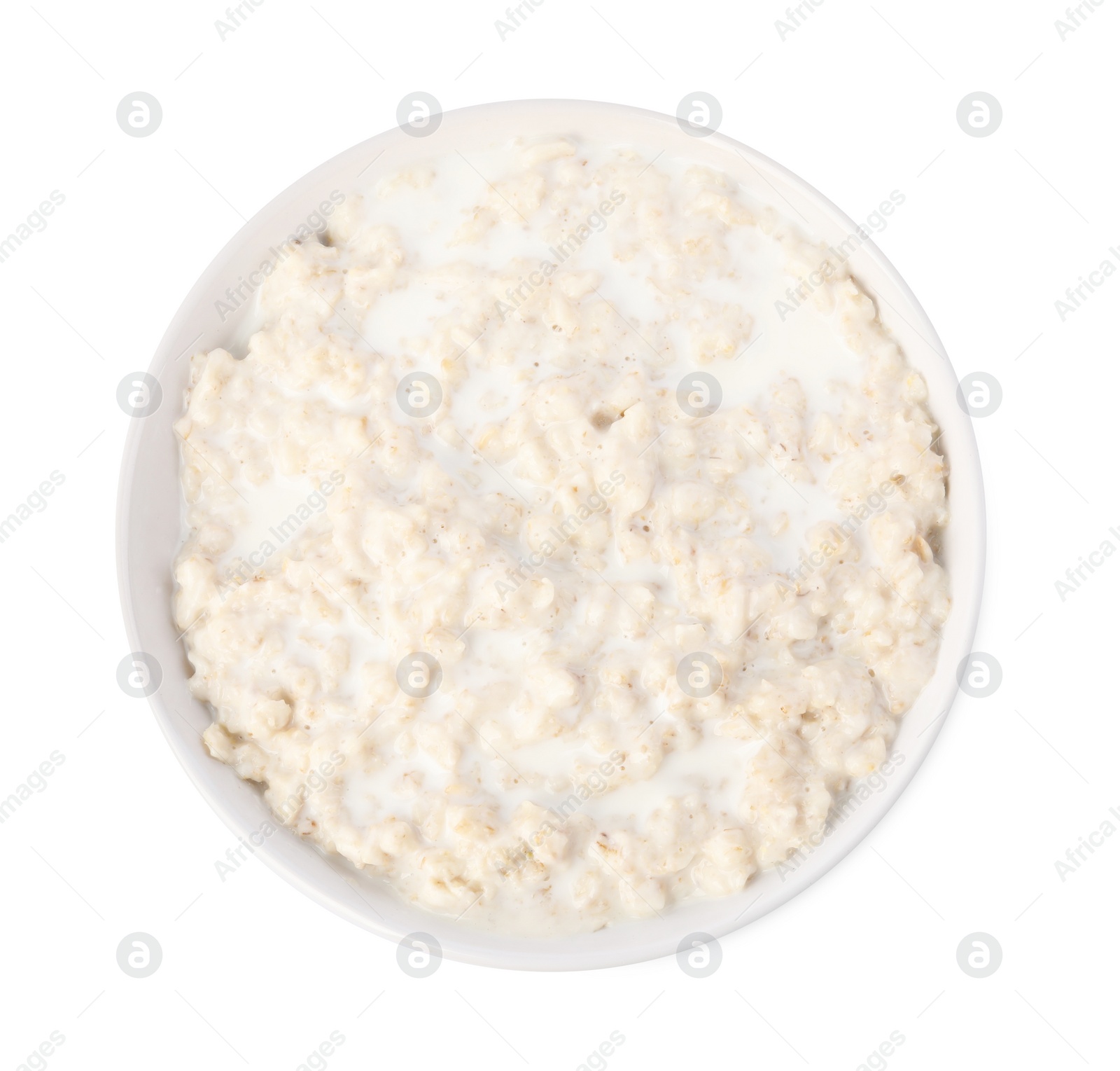 Photo of Tasty boiled oatmeal in bowl isolated on white, top view