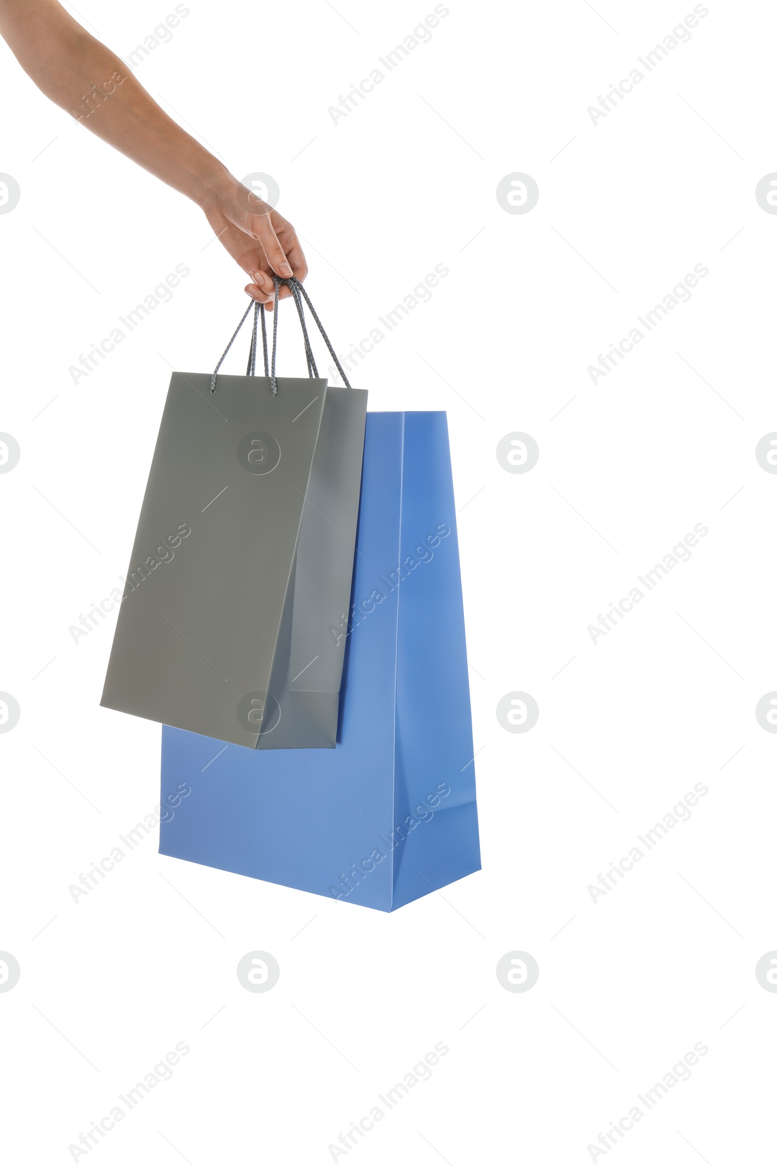 Photo of Woman with paper shopping bags on white background, closeup