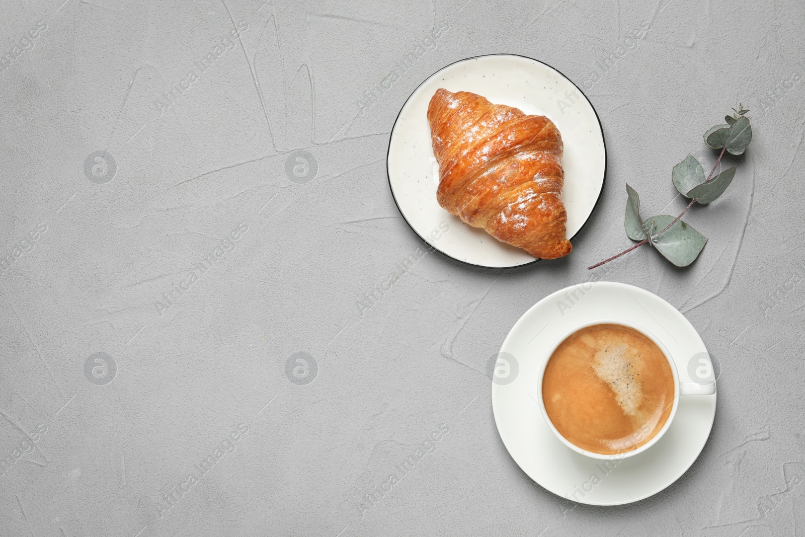 Photo of Tasty breakfast served on light grey table, flat lay. Space for text