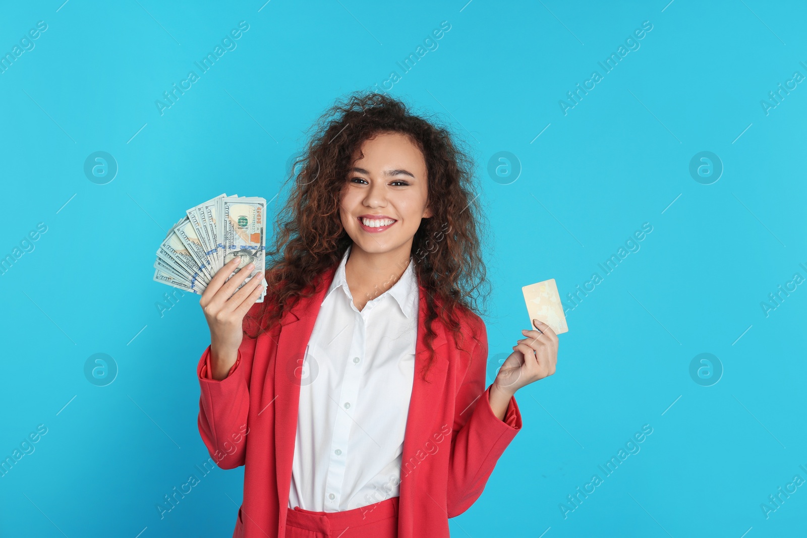 Photo of African-American businesswoman with money and credit card on color background. Space for text