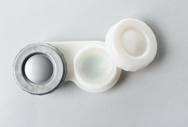 Container for contact lenses on light background