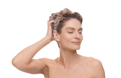 Photo of Beautiful woman washing hair on white background