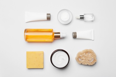 Flat lay composition with body care products on white background