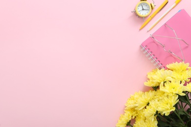 Photo of Beautiful flowers and stationery on pink background, flat lay with space for text. Teacher's Day