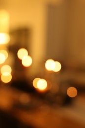 Photo of Blurred view of festive table setting and beautiful Christmas decor indoors