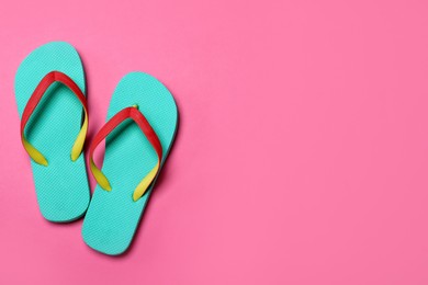 Photo of Stylish flip flops on pink background, flat lay. Space for text