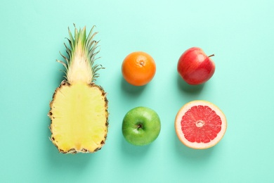 Flat lay composition with fresh fruits on color background