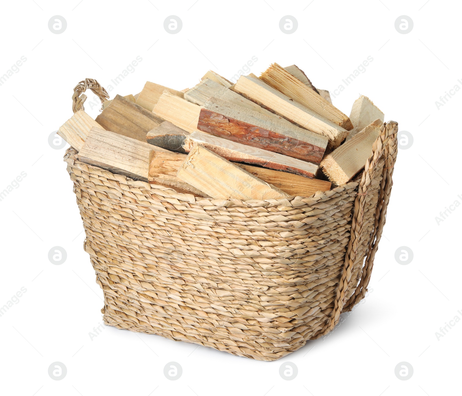 Photo of Wicker basket with cut firewood isolated on white