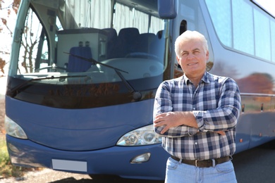 Professional driver standing near bus. Passenger transportation