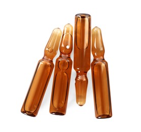 Photo of Glass ampoules with pharmaceutical product on white background, top view