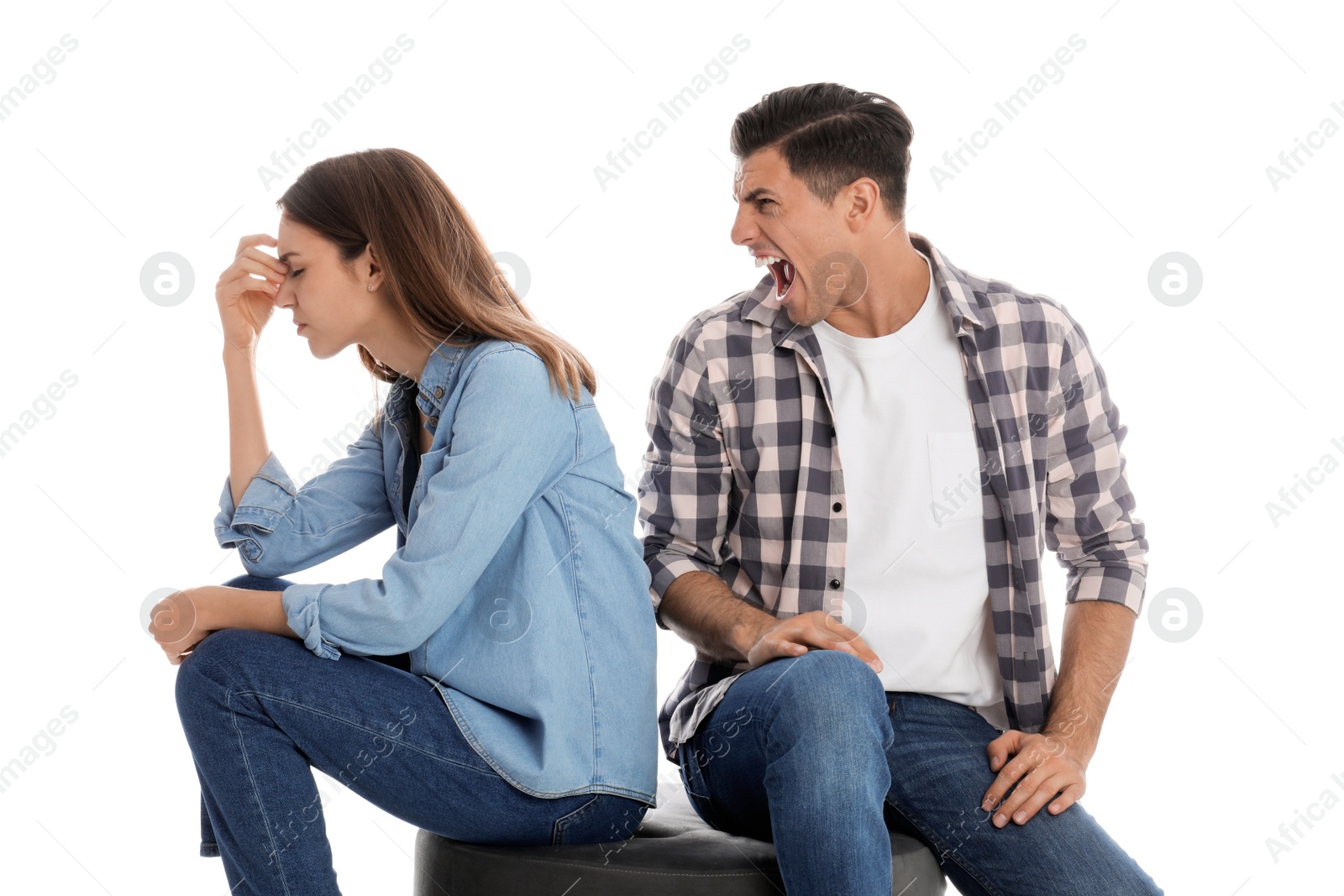 Photo of Man shouting at his girlfriend on white background. Relationship problems