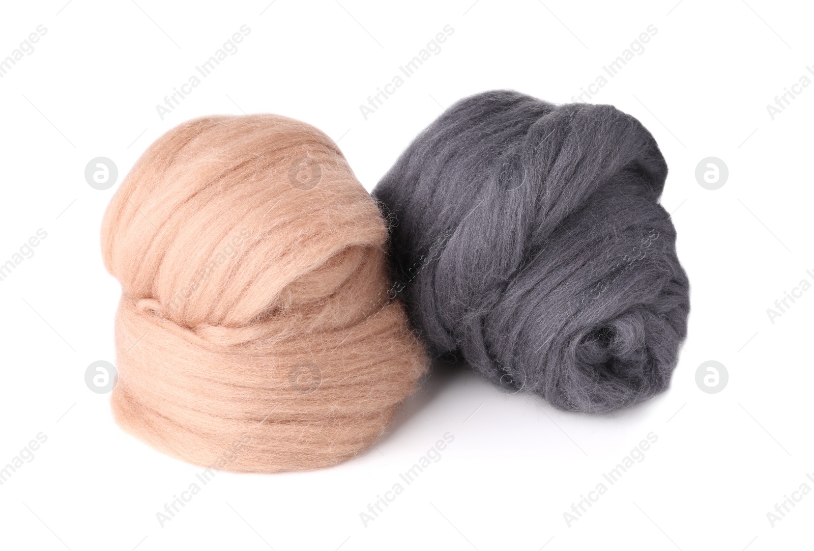 Photo of Beige and grey felting wool isolated on white