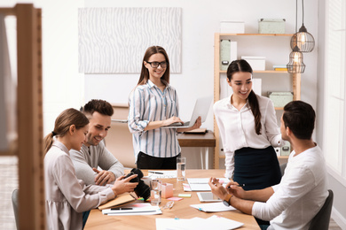 Team of professional journalists working in office