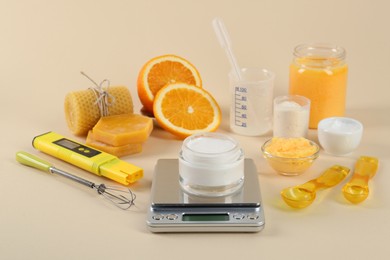 Photo of Homemade cosmetic products and fresh ingredients on beige background