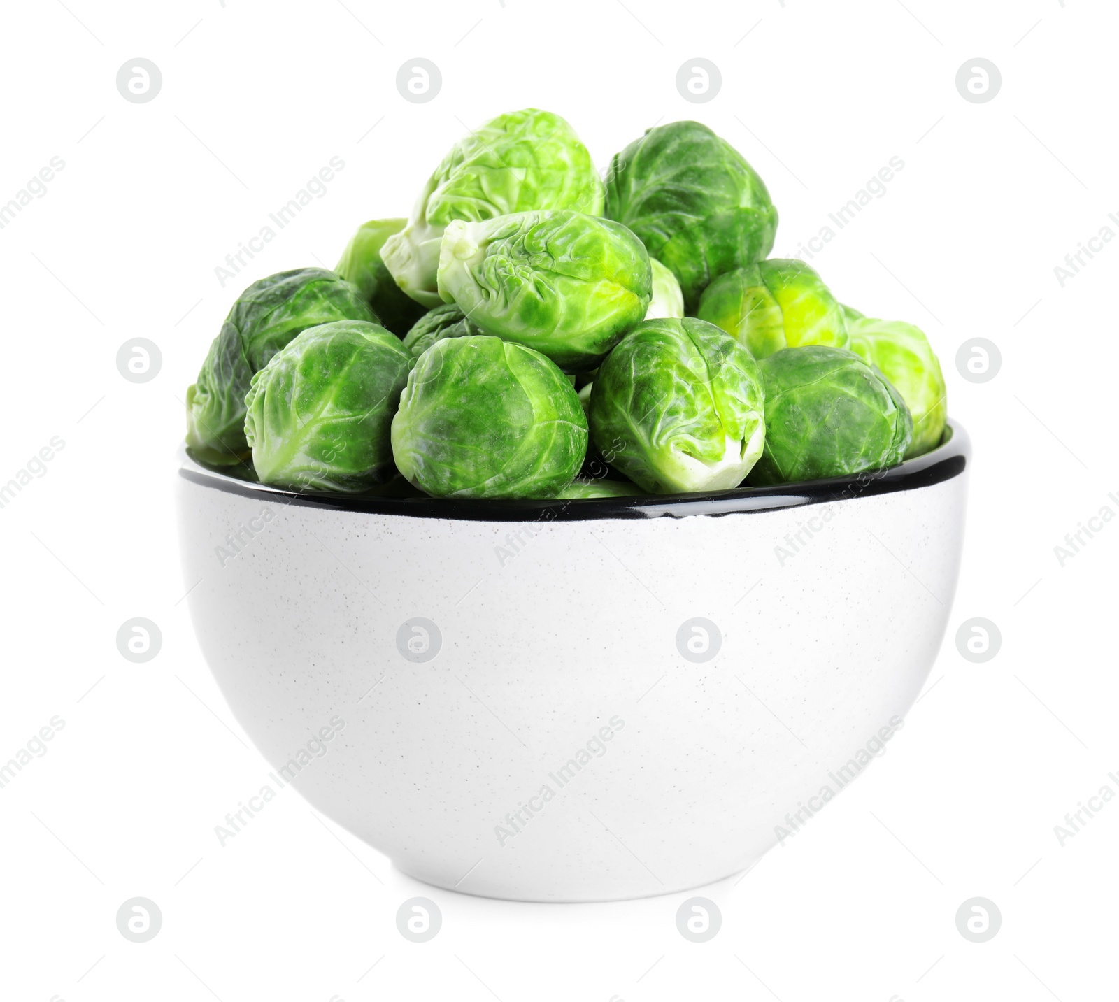 Photo of Fresh Brussels sprouts in bowl isolated on white